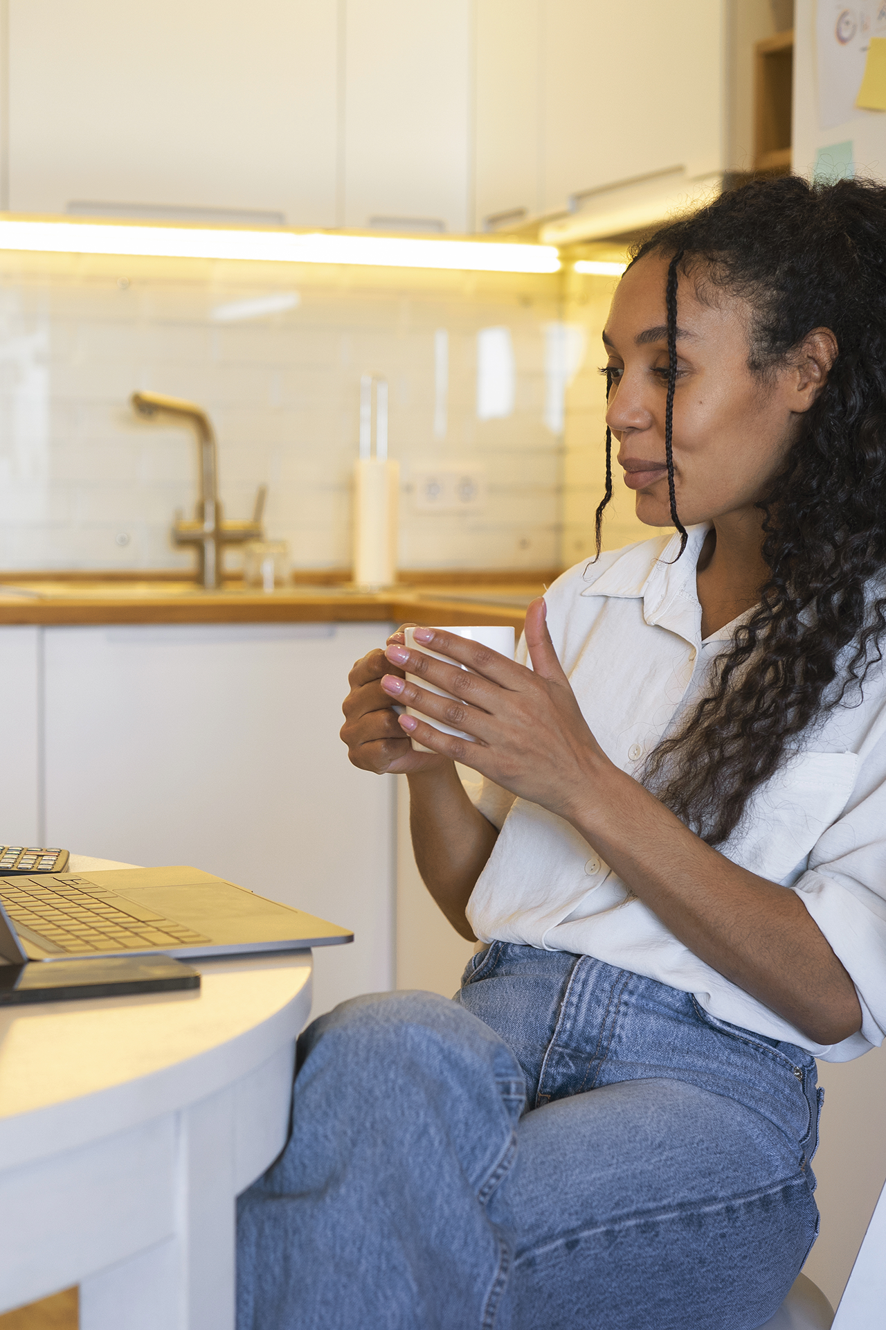 I AM Self Governance Method - Mother working at kitchen table in front of laptop - C Kinion Design