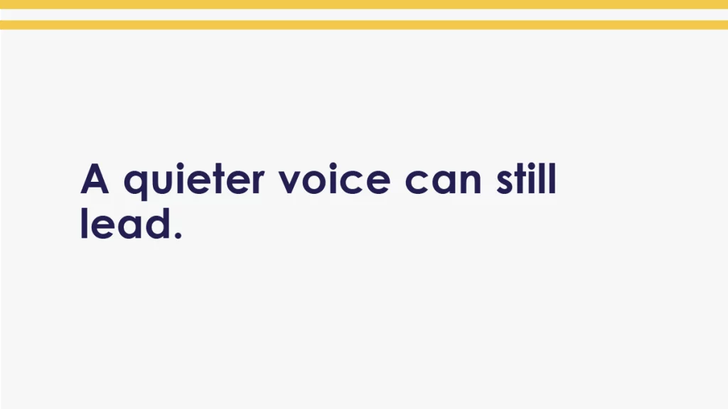 Body image with the words “A quieter voice can still lead.” on a clean white background with a double gold band at the top.